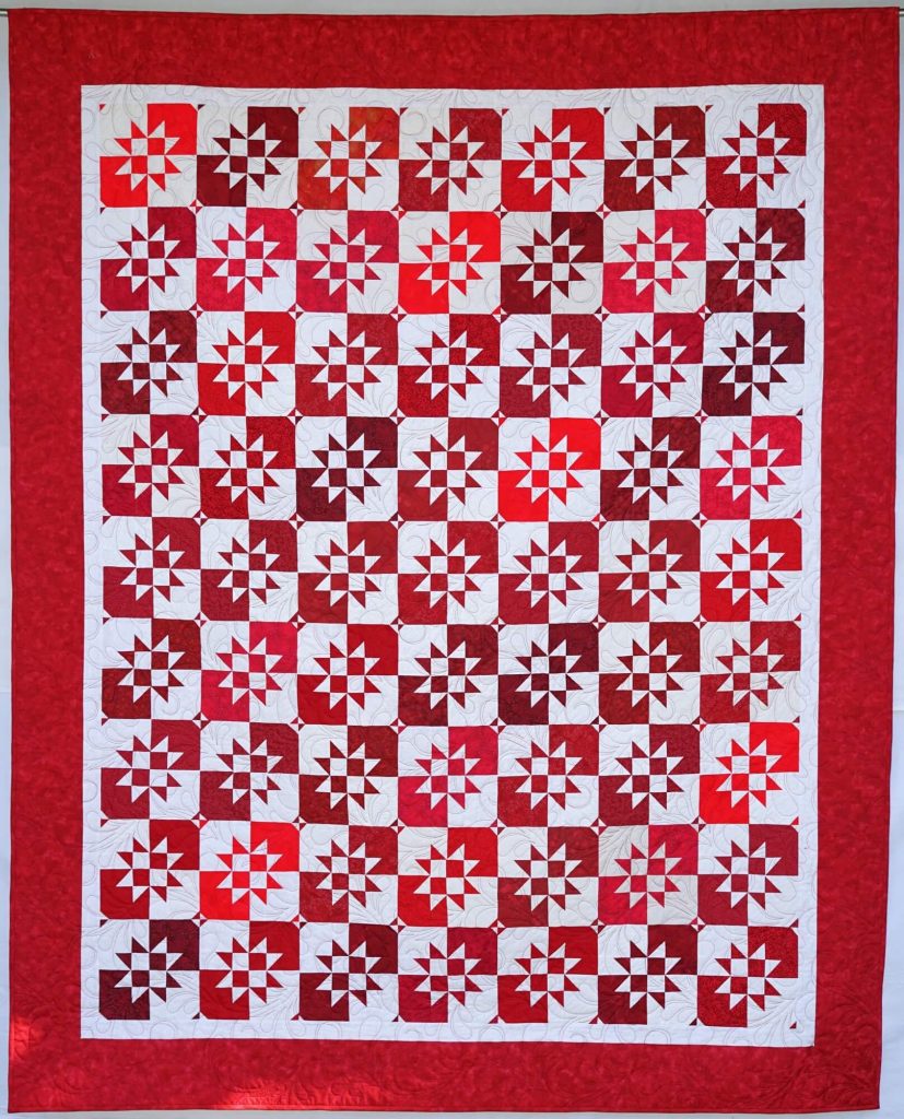 patchwork gilde austria quiltfest Helen Heaney Disappearing Hourglass in red and white
